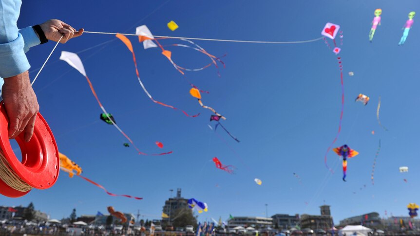 A kite is launched the Festival of the Winds.