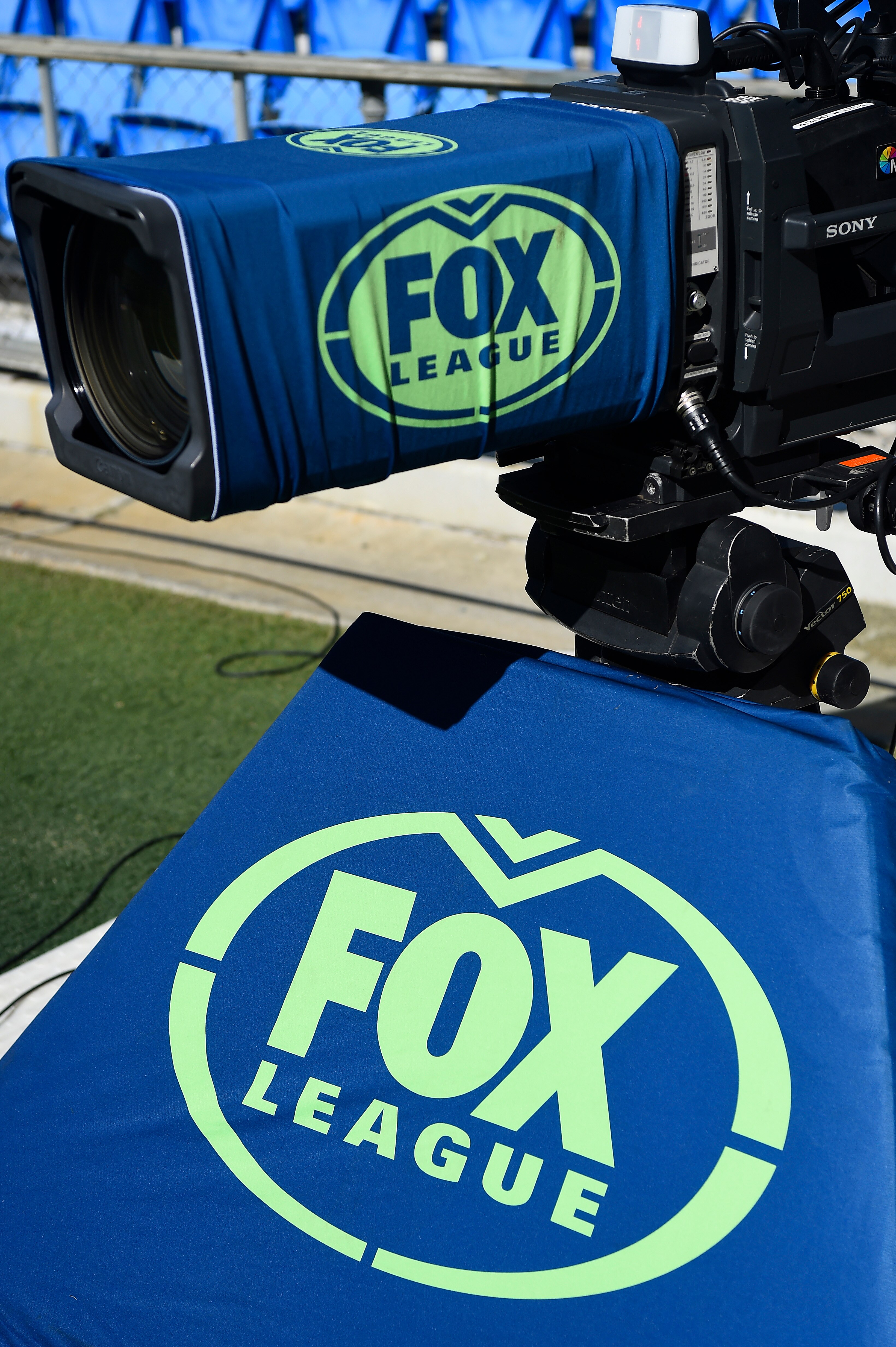 A camera with a Fox League logo on it at an NRL game.