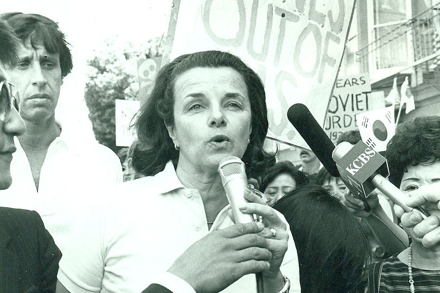 A young Dianne Feinstein speaking at a rally 