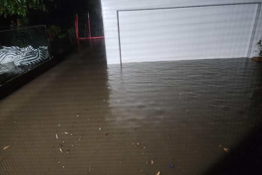 Water up the side of a garage door.