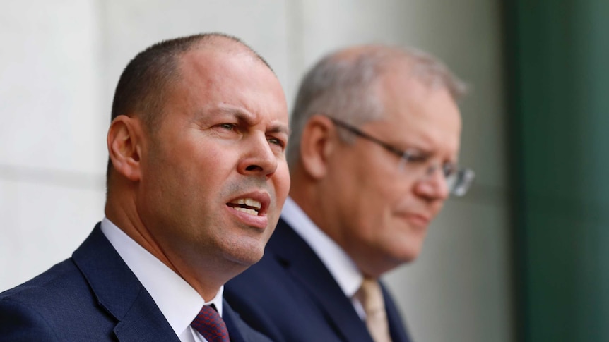 Josh Frydenberg and Scott Morrison speak to reporters in a courtyard