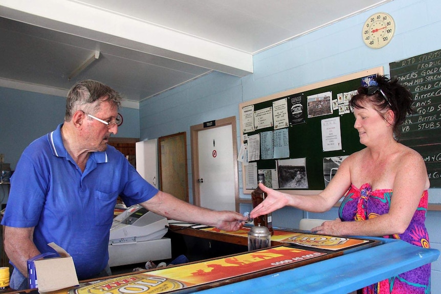 Marmor publican Frank Seymour-Smith takes a break from cleaning up to serve Susy Coburn, from nearby Bajool