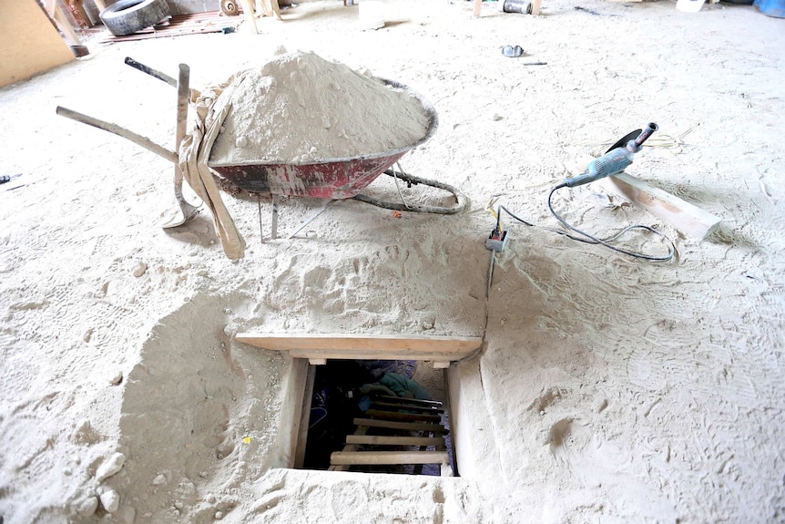 A wheelbarrow sits next to the entrance of a tunnel used by Guzman to escape the Altiplano Federal Penitentiary.
