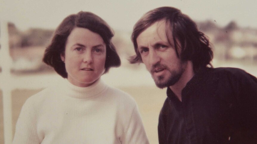 An old photo of a woman and a man posing for the camera, around the 1970s or 80s.