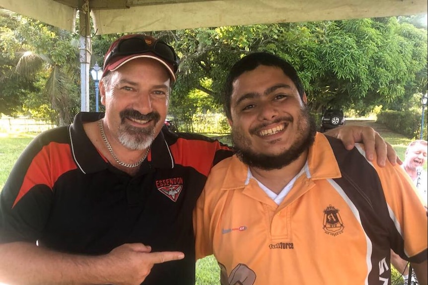 Rob Fisher and Felipe Lima de Melo smile happily.