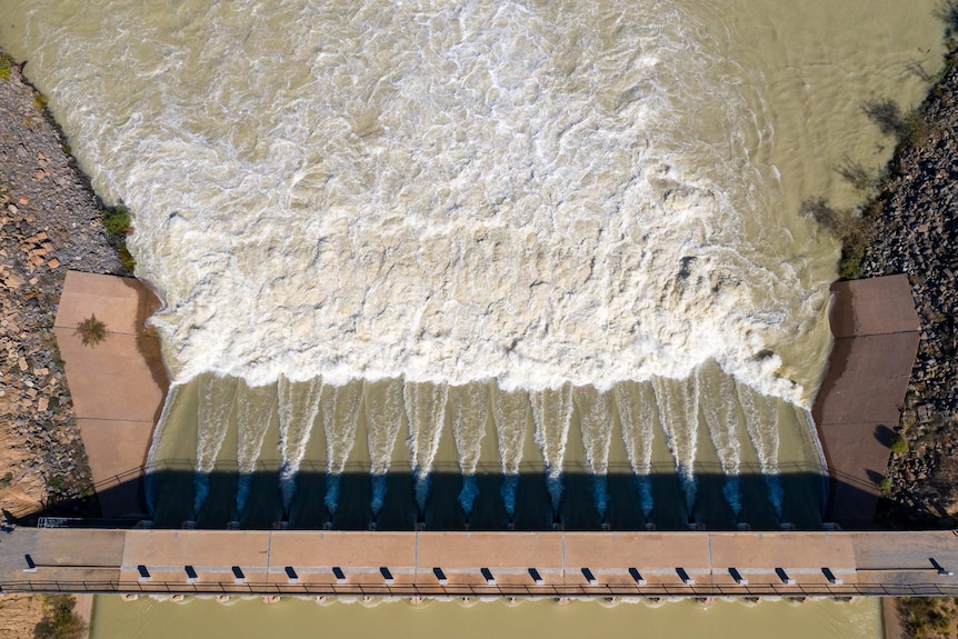 An aerial photo of water flowing through the gates at Lake Menindee, April 2021