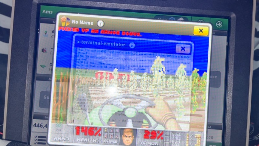 Close up of a john deere display with video game DOOM overlayed on the screen