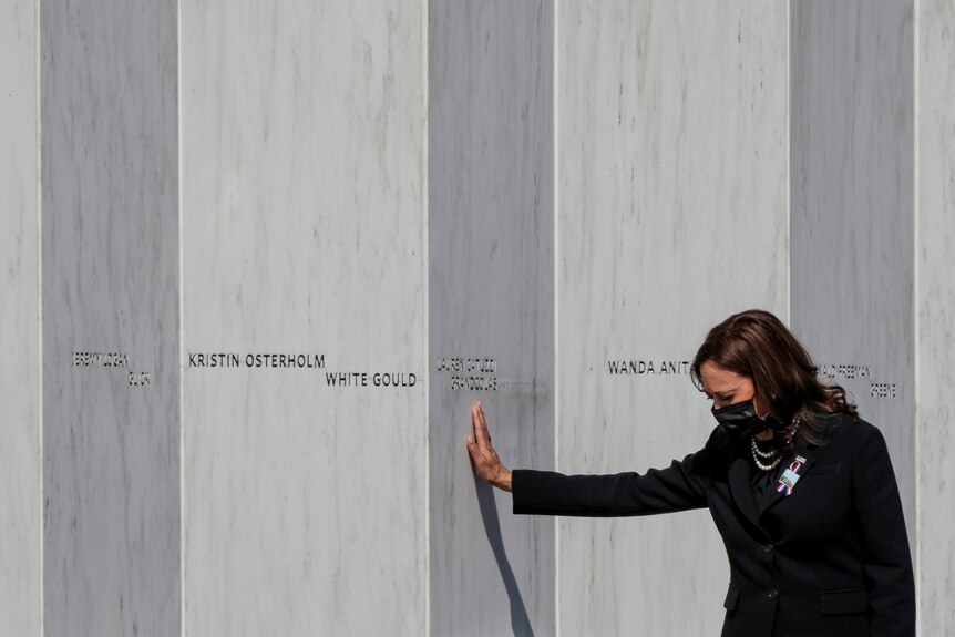 US Vice President Kamala Harris lays a hand on the Flight 93 memorial in Pennsylvania, September 11, 2021.