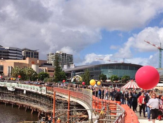 Thousands take a first chance to cross the Torrens footbridge