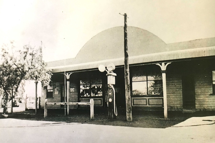 A black and white image of the Eulo General Store in the early 1900s with a petrol pump outside.