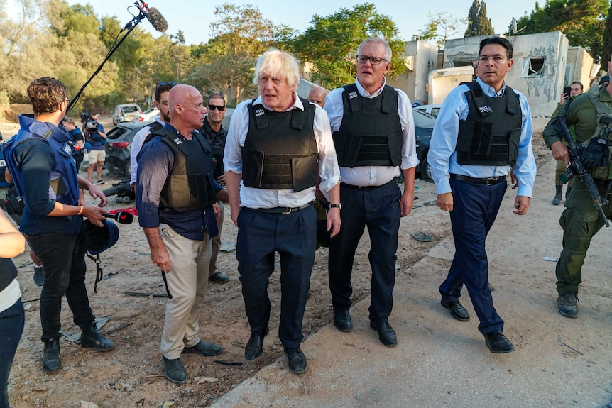 Boris Johnson and Scott Morrison in flak jackets 
