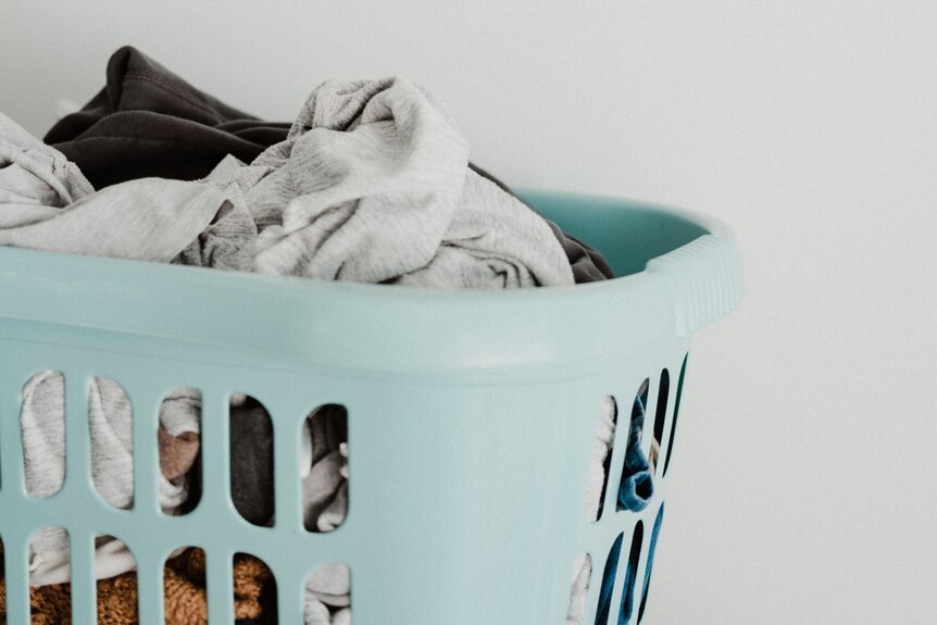 Laundry basket full of clean clothes.