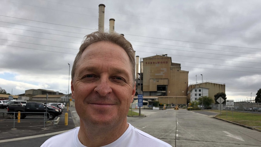 Tony Bogan standing in front of the Hazelwood power station.