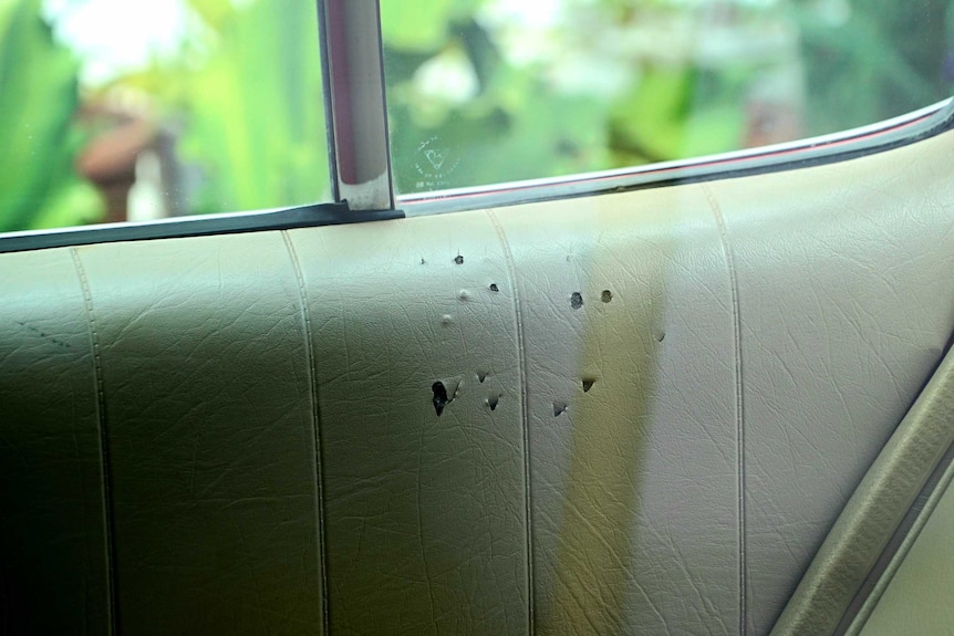 Scratch marks on the lining inside a car.