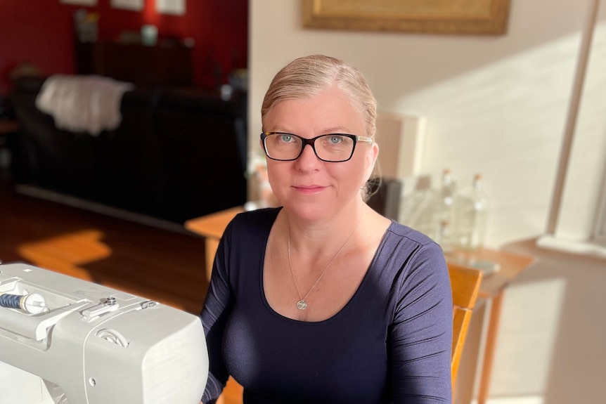 Jo Wintle at a sewing machine, for a story about the benefits of hobbies.