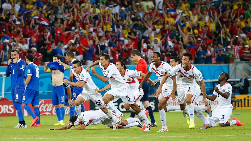 Costa Rica's players celebrate after winning the penalty shootout against Greece at the World Cup.