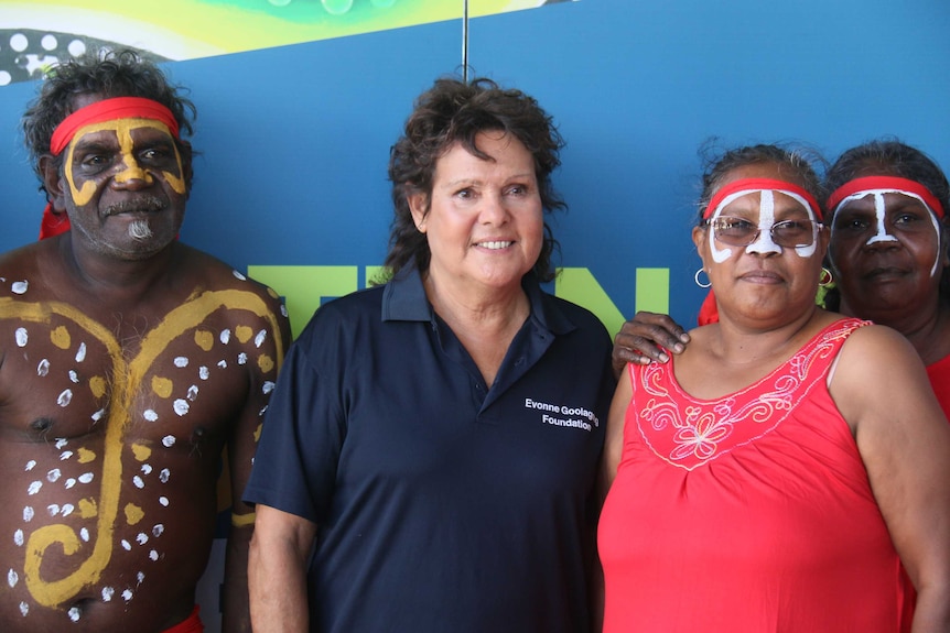 Evonne Goolagong Cawley stands with Aboriginal performers at the carnival launch