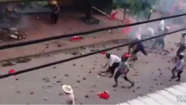 Protestors in Chinese village Wukan clash with police, throwing rocks and stones.