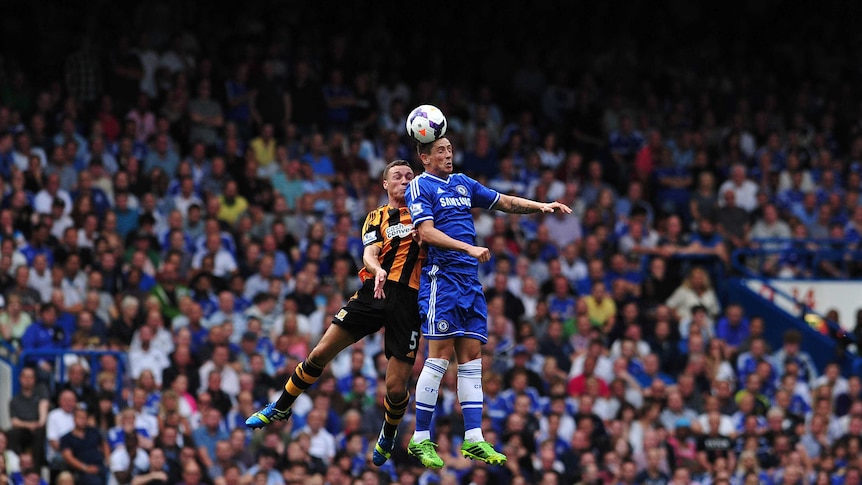 Chelsea's striker Fernando Torres (right) beats Hull City's defender James Chester