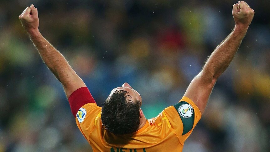 Socceroos captain Lucas Neill celebrates victory over Iraq,