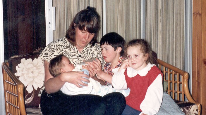 Patricia, Luke and Emmalee with baby Paul soon after his adoption.