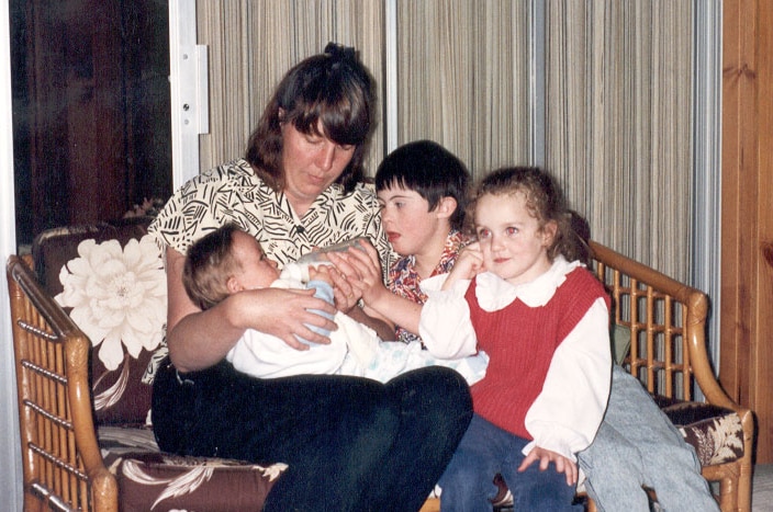 Patricia, Luke and Emmalee with baby Paul soon after his adoption.
