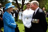 Queen Elizabeth is greeted by Arthur 'Bushy' Pembroke and his Granddaughter Staff Cadet Harriet Pembroke