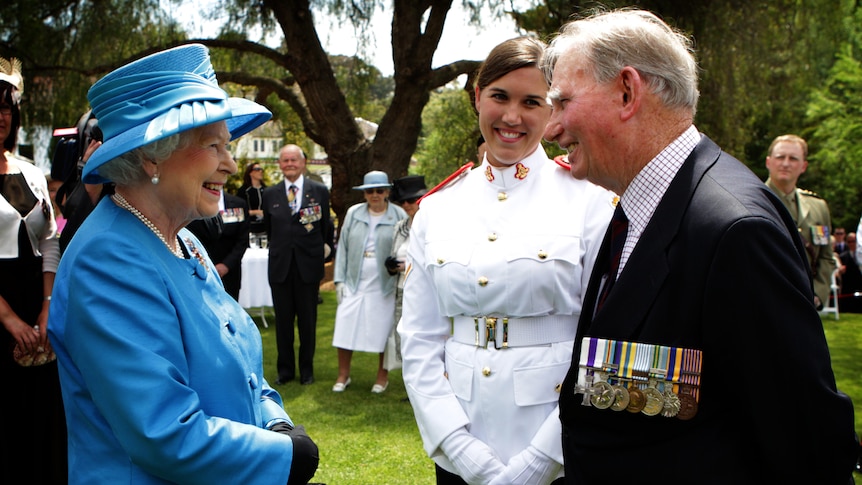 Queen Elizabeth is greeted by Arthur 'Bushy' Pembroke and his Granddaughter Staff Cadet Harriet Pembroke