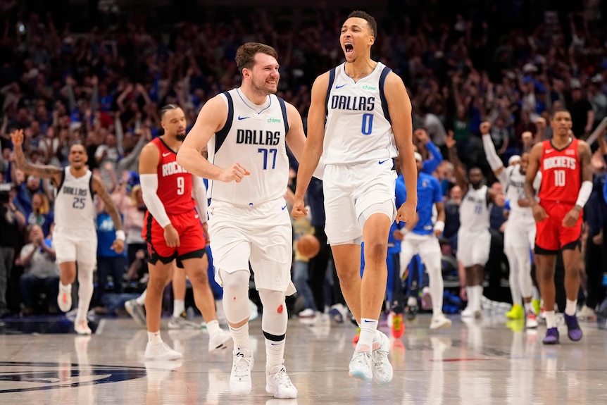 Dante Exum and Luka Doncic celebrate a bucket