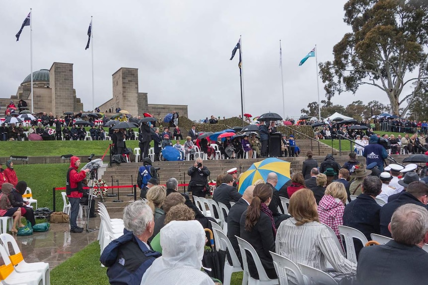 Hundreds of people braved the wet conditions to attend today's Remembrance Day service in Canberra.