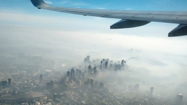 View of Sydney CBD shrouded in bushfire smoke from a plane.