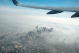 View of Sydney CBD shrouded in bushfire smoke from a plane.