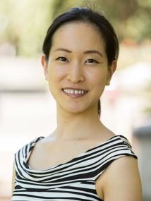 A young woman smiling