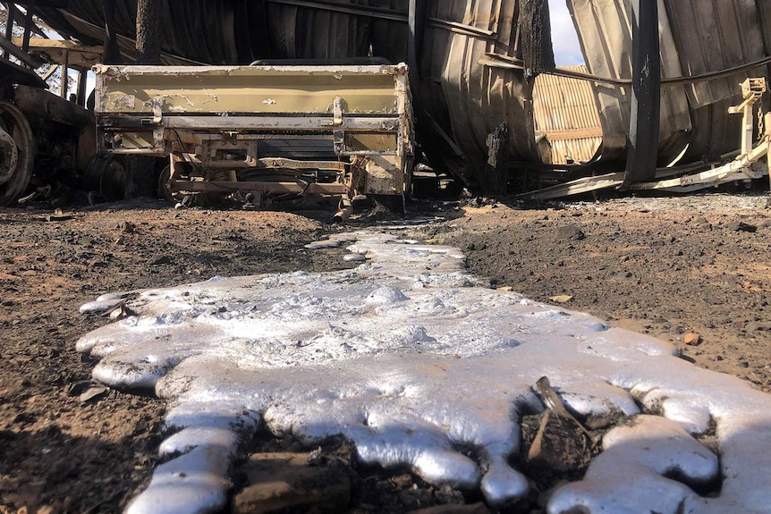 Melted equipment after a bushfire at a pineapple farm at Bungundarra.