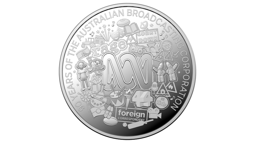 A round silver coin with the ABC logo.