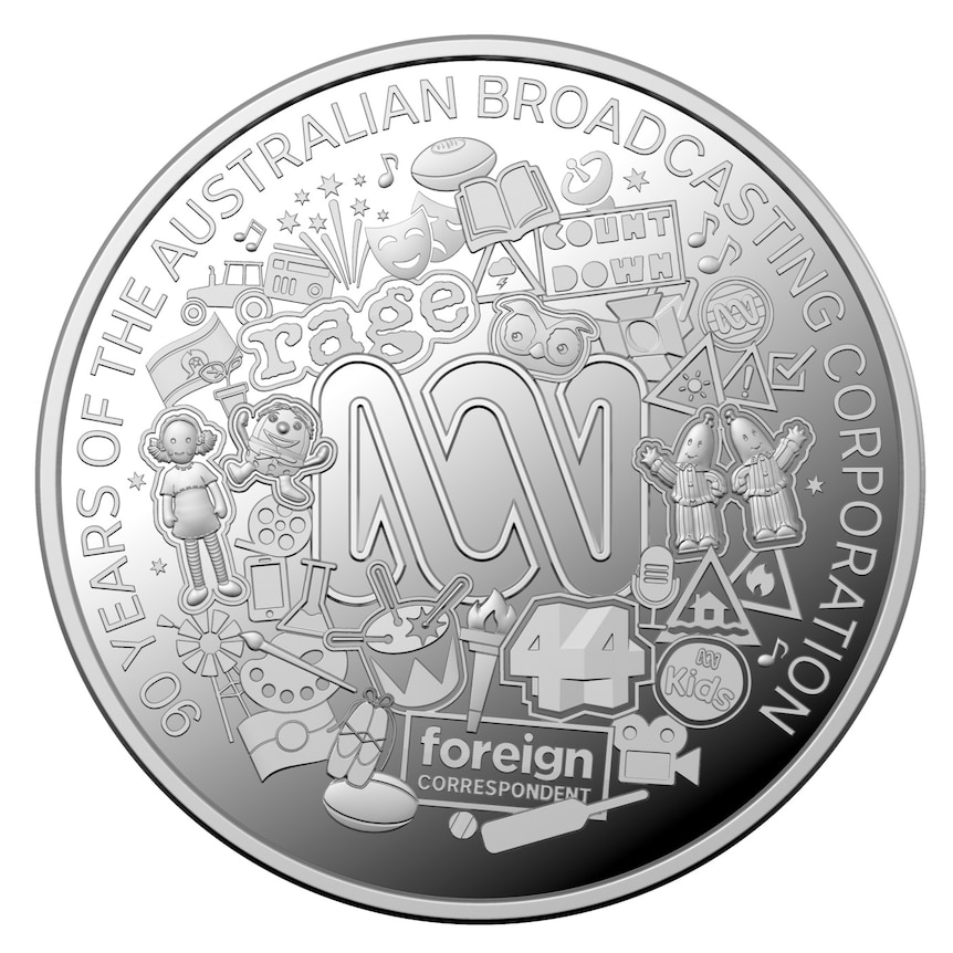 A round silver coin with the ABC logo.