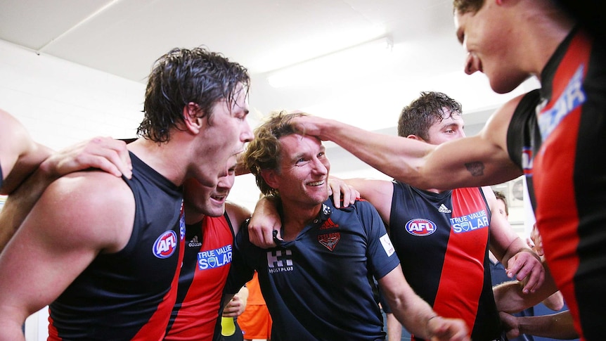 Bombers coach James Hird celebrates with his team after their win over Fremantle at Subiaco.