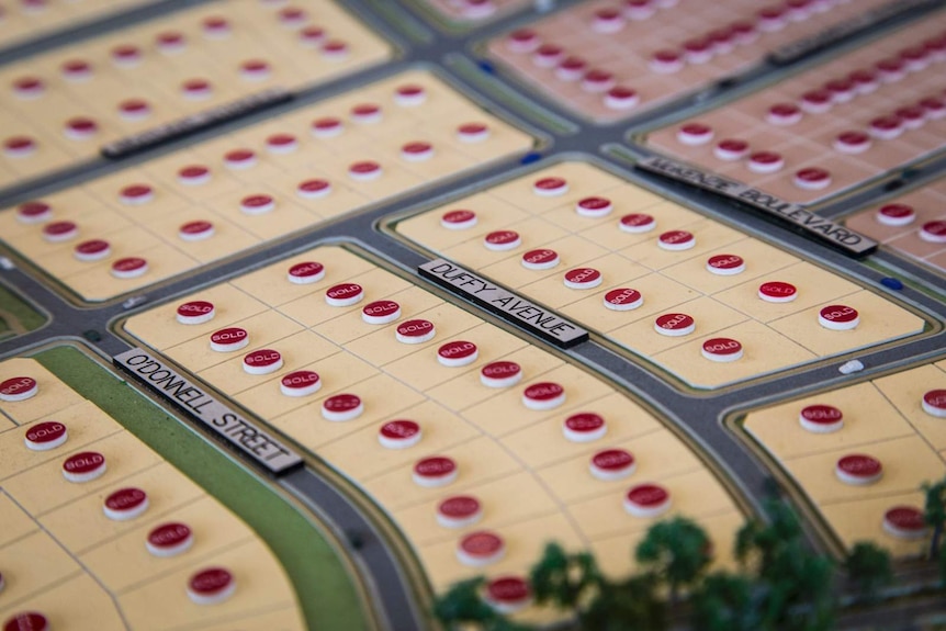 a close up of a model town showing street names and red circles