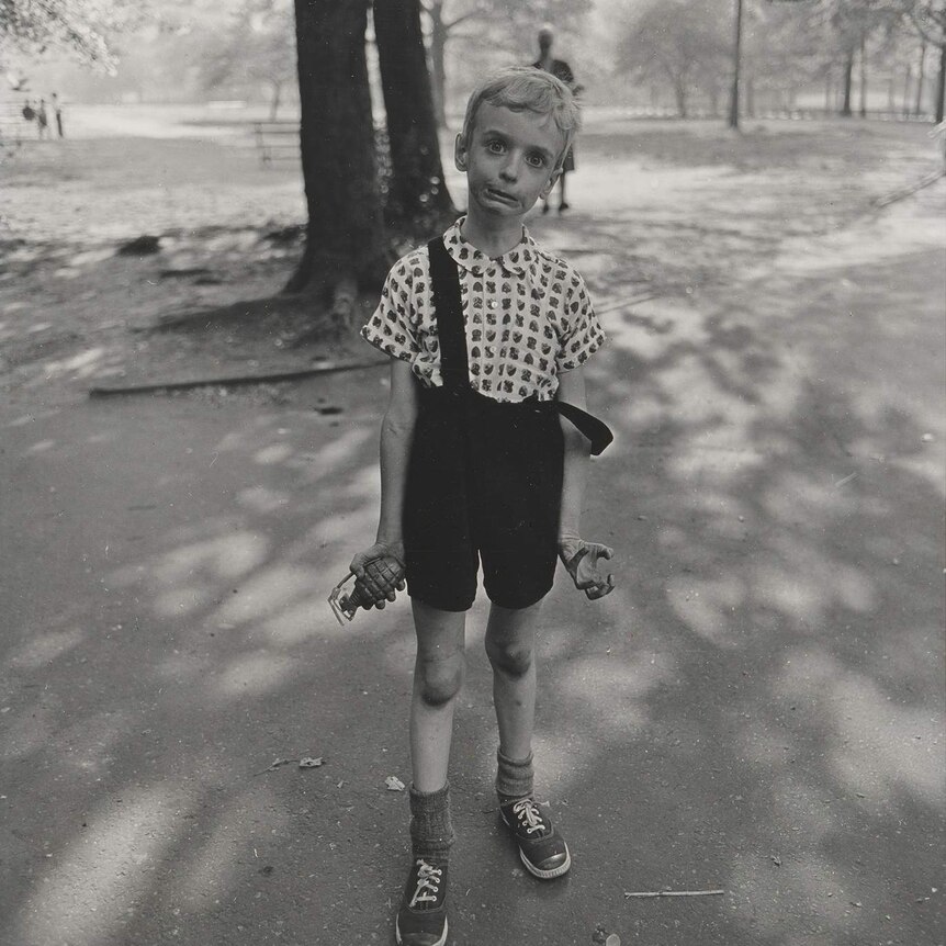 Child with toy hand grenade, in Central Park, New York City by Diane Arbus