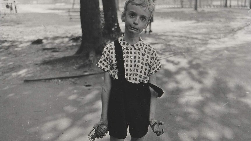 Child with toy hand grenade, in Central Park, New York City by Diane Arbus