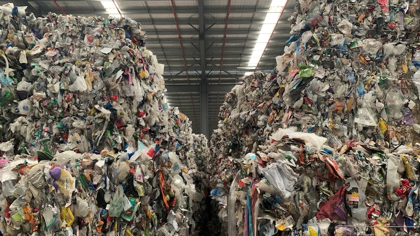 A close-up shot of two tower pile of rubbish.