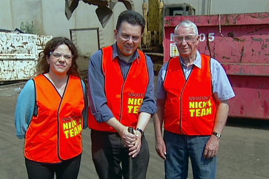 Connie Bonaros, Nick Xenophon and John Darley in hi-vis vests.