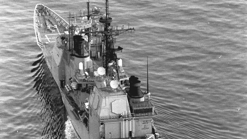 A black and white photo of a US Navy ship.