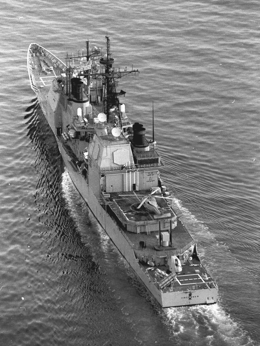 A black and white photo of a US Navy ship.