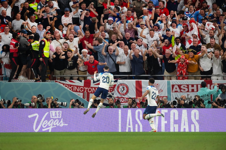 Phil Foden leaps in the air in front of thousands of wildly celebrating England fans.