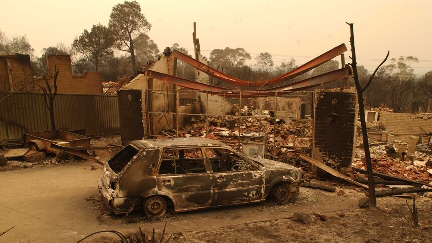 Burnt car and houses in Duffy.