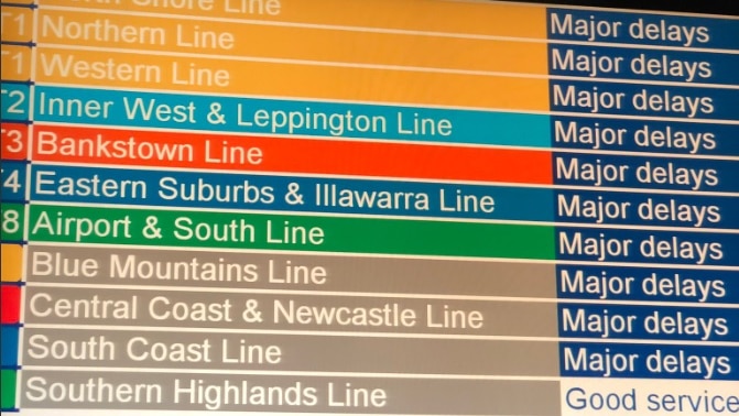 A sign reading "major delays" at Central Station.