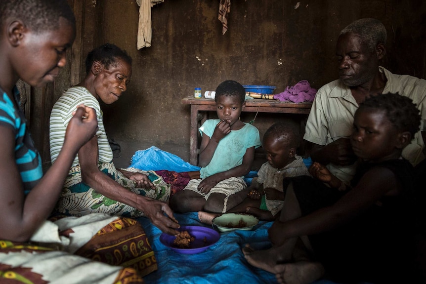 The family share mashed masawu (Left to right) Theresa 18, Theresa 53, Precious 7, Brave 1, Richard 63, Priscilla 3.