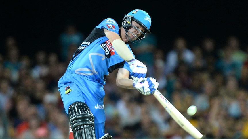 In form ... Travis Head hits the ball to the boundary for a four during the Strikers' victory