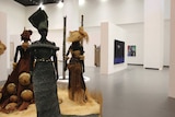 An exhibition space shows three mannequins wearing traditional African textiles.